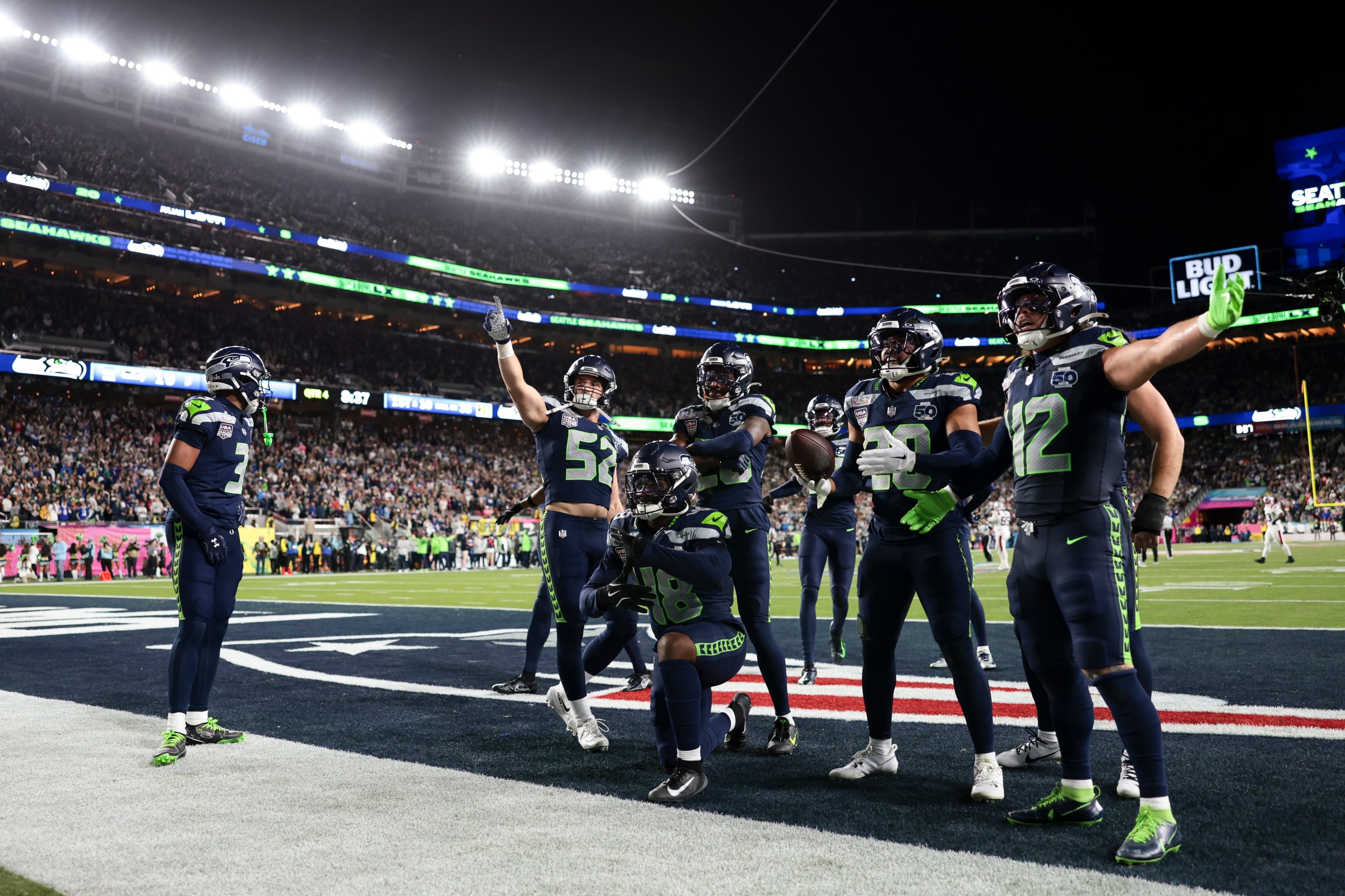 SANTA CLARA, CALIFORNIA - FEBRUARY 08: Tyrice Knight #48 of the Seattle Seahawks, Julian Love #20 of the Seattle Seahawks, Patrick O’Connell #52 of the Seattle Seahawks, Drake Thomas #42 of the Seattle Seahawks, Nick Emmanwori #3 of the Seattle Seahawks celebrate after an interception during the second half of Super Bowl LX at Levi’s Stadium against the New England Patriots on February 08, 2026 in Santa Clara, California. (Photo by Kathryn Riley/Getty Images)