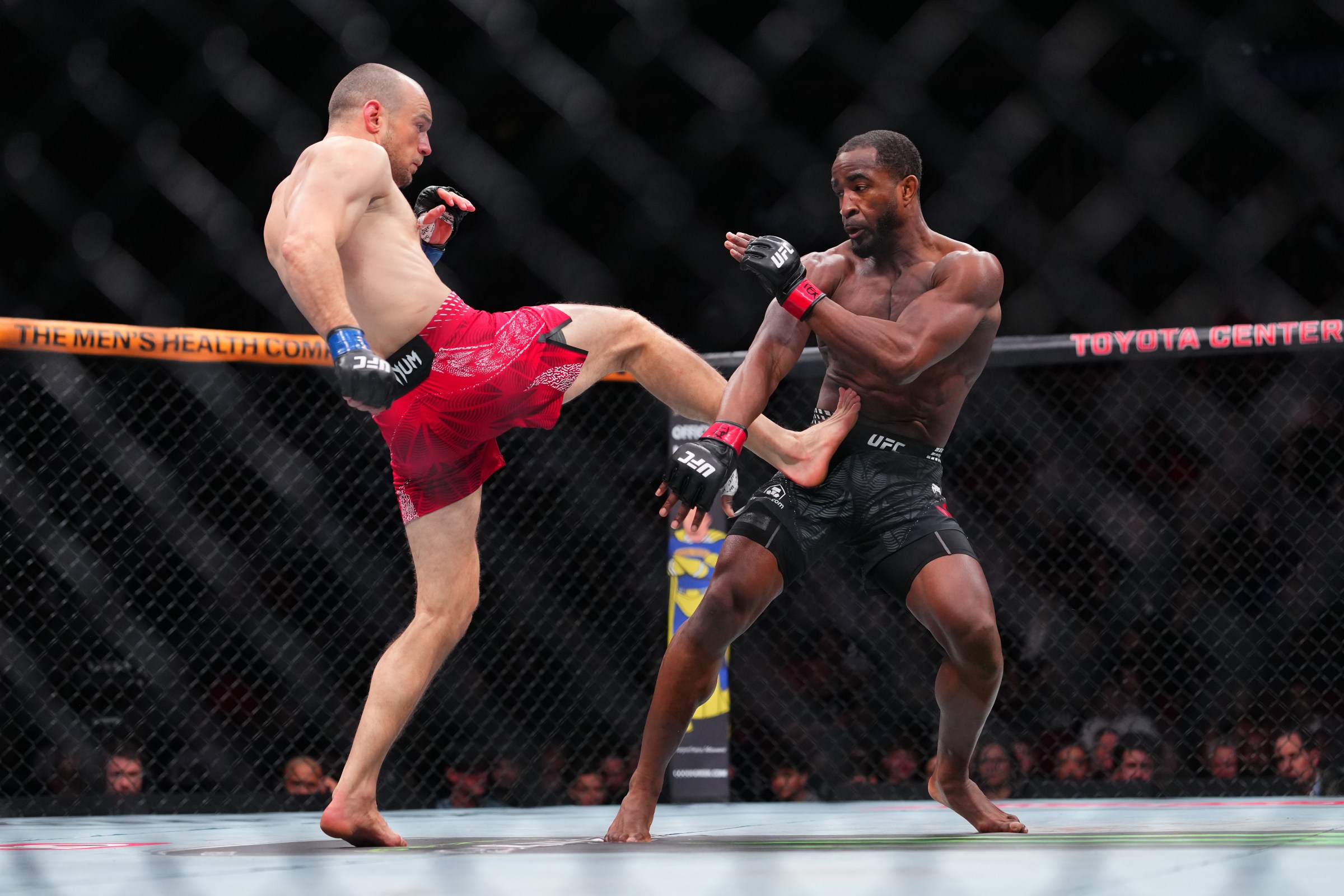 HOUSTON, TEXAS - FEBRUARY 21: (L-R) Uros Medic of Serbia kicks Geoff Neal in a welterweight fight during the UFC Fight Night event at Toyota Center on February 21, 2026 in Houston, Texas. (Photo by Cooper Neill/Zuffa LLC)