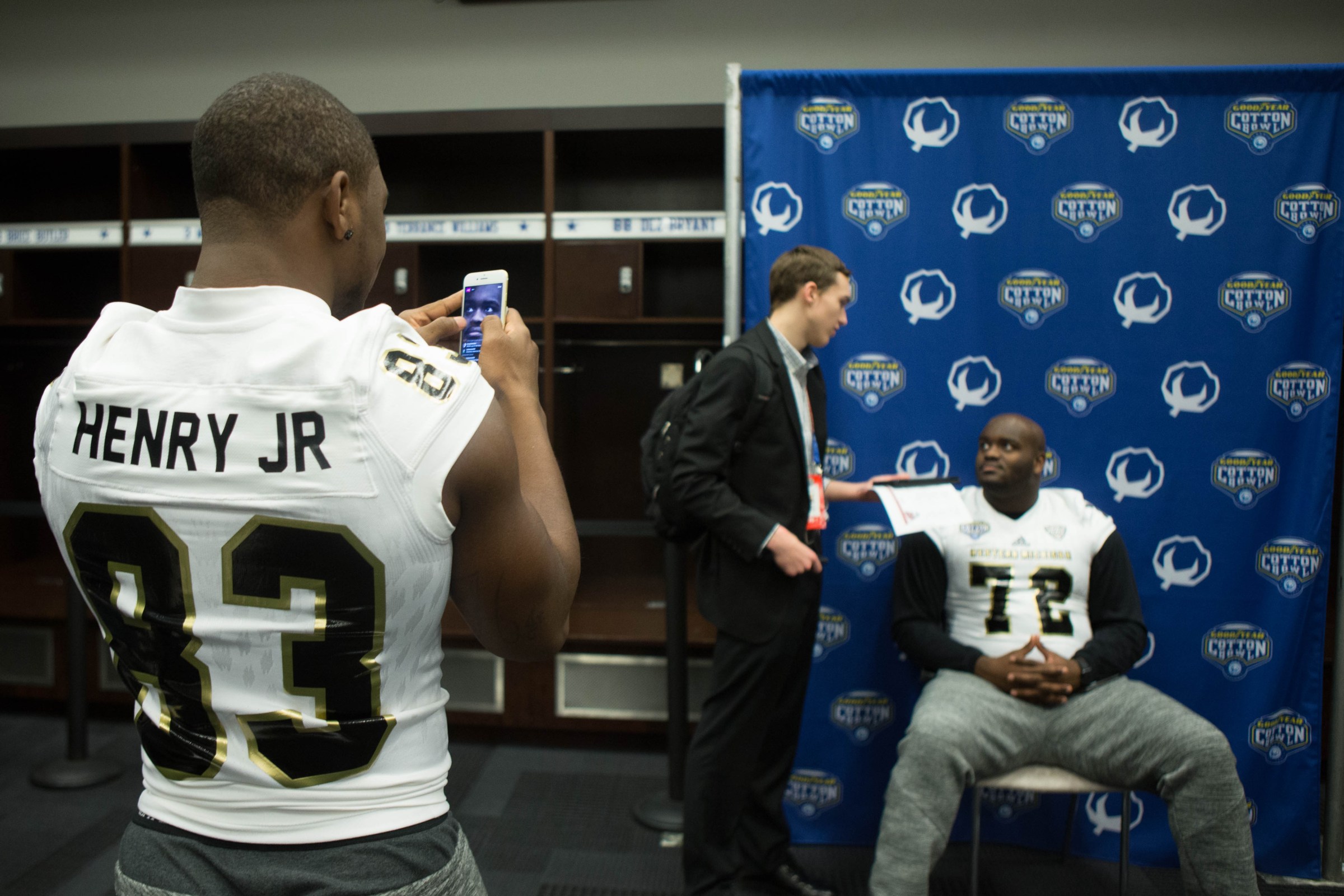 ARLINGTON, TX - DECEMBER 31: Western Michigan Broncos wide receiver Michael Henry (83) takes pictures of Western Michigan Broncos offensive lineman Taylor Moton (72) during the Cotton Bowl Classic Western Michigan Media day on December 31, 2016 at ATT Stadium in Arlington, Texas. (Photo by William Purnell/Icon Sportswire via Getty Images)