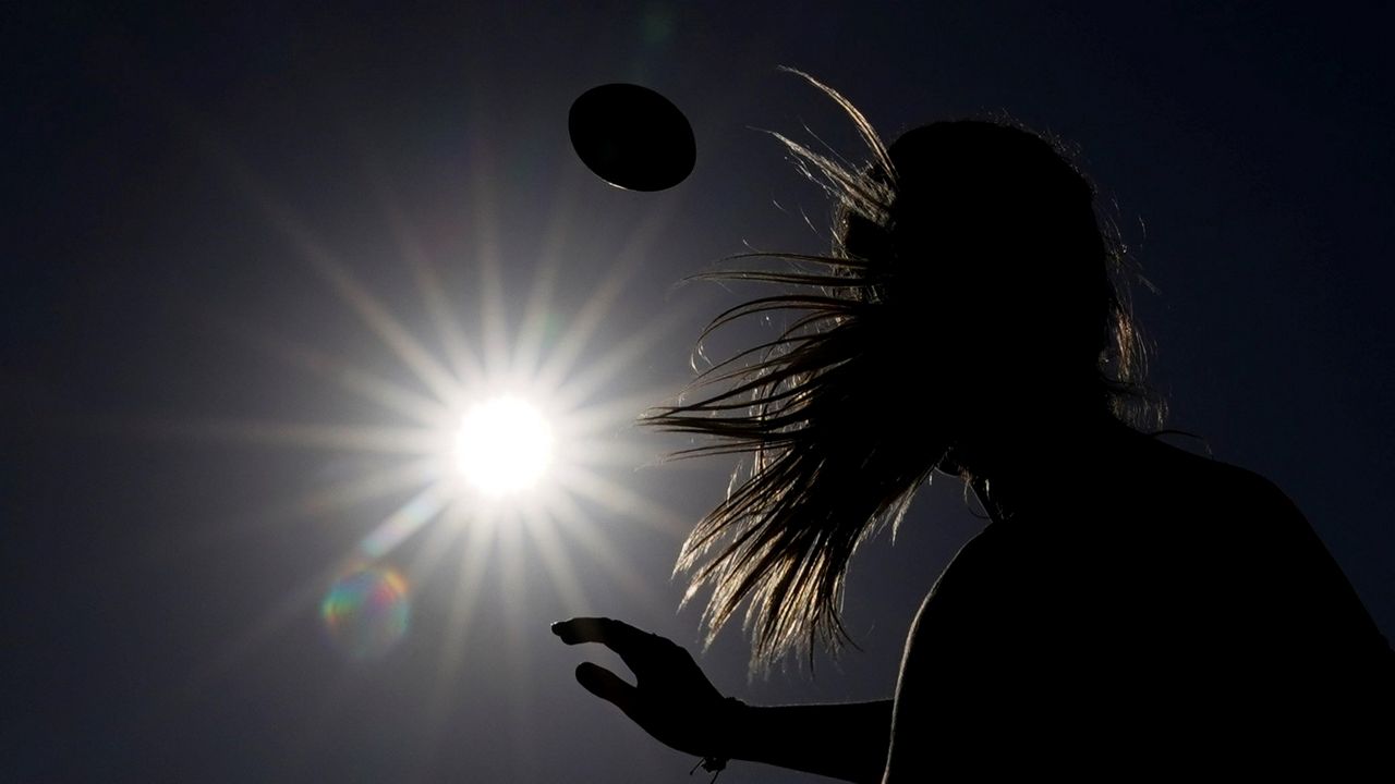 Shale Harris, 15, throws a pass as she tries out for the Redondo Union High School girls flag football team on Thursday, Sept. 1, 2022, in Redondo Beach, Calif. (AP Photo/Ashley Landis)