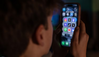 iPhone screen displaying various social media apps on December 23, 2025.