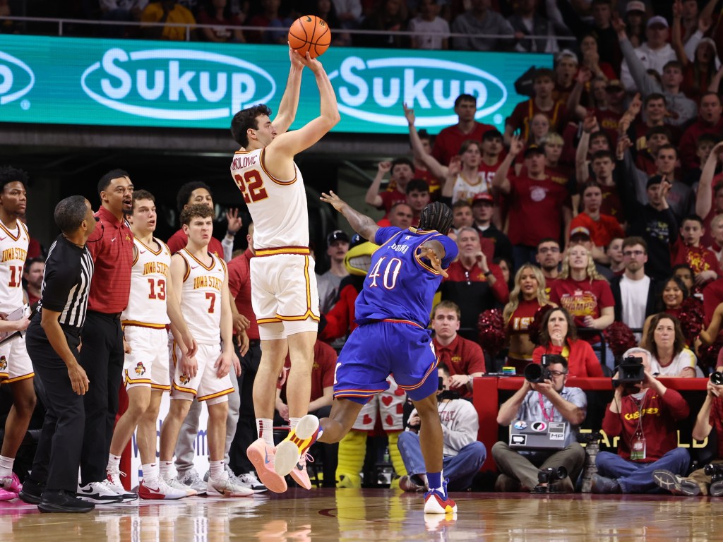 Iowa State Cyclones forward Milan Momcilovic (22) shoots over Kansas Jayhawks forward Flory Bidunga (40).