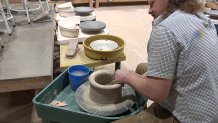 John Campbell makes a bowl for the Empty Bowls fundraiser.