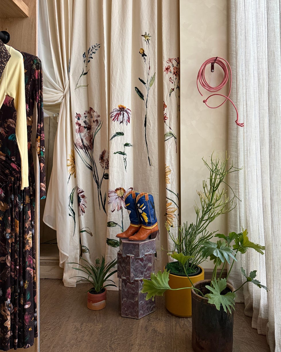 store with cowboys boots and rack of clothing