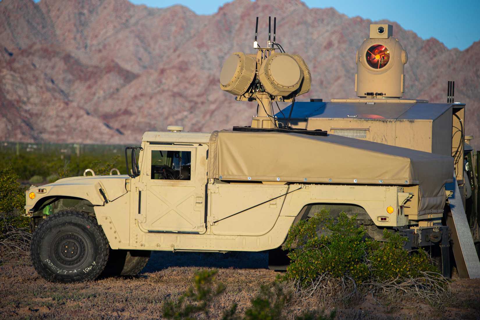 Marine Corps HMMWV with a mounted beam director and radar.