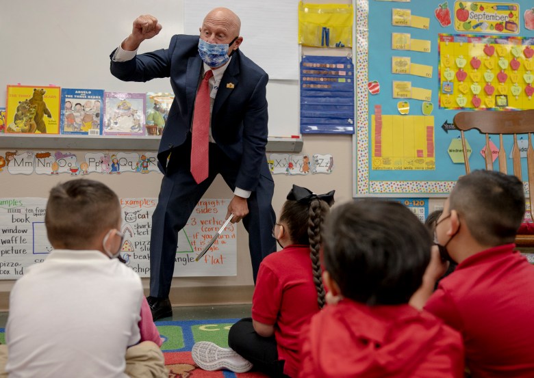 Dr. Robert Jaklich, SAISD’s interim superintendent, makes a pinky promise with kindergartners to work hard at Wilson Elementary on Thursday.