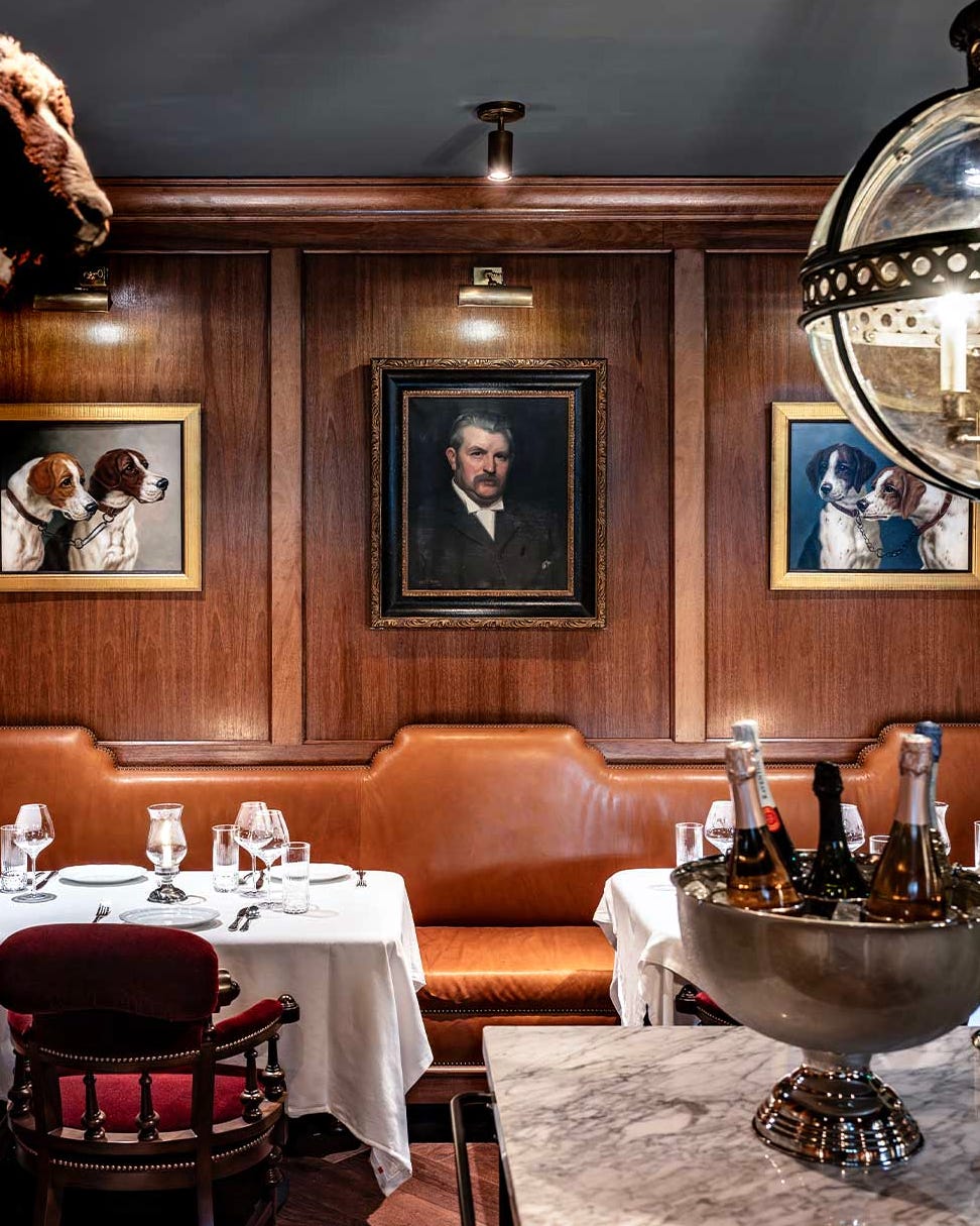 elegant restaurant interior with artwork and dining setup