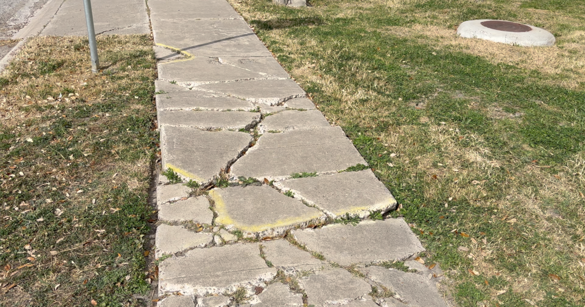 Resident calls for sidewalk repairs near Travis Elementary