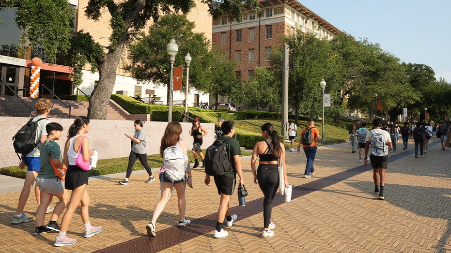 students walking around university school campus