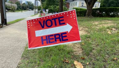 "Vote here" sign outside a polling place. (Spectrum News)