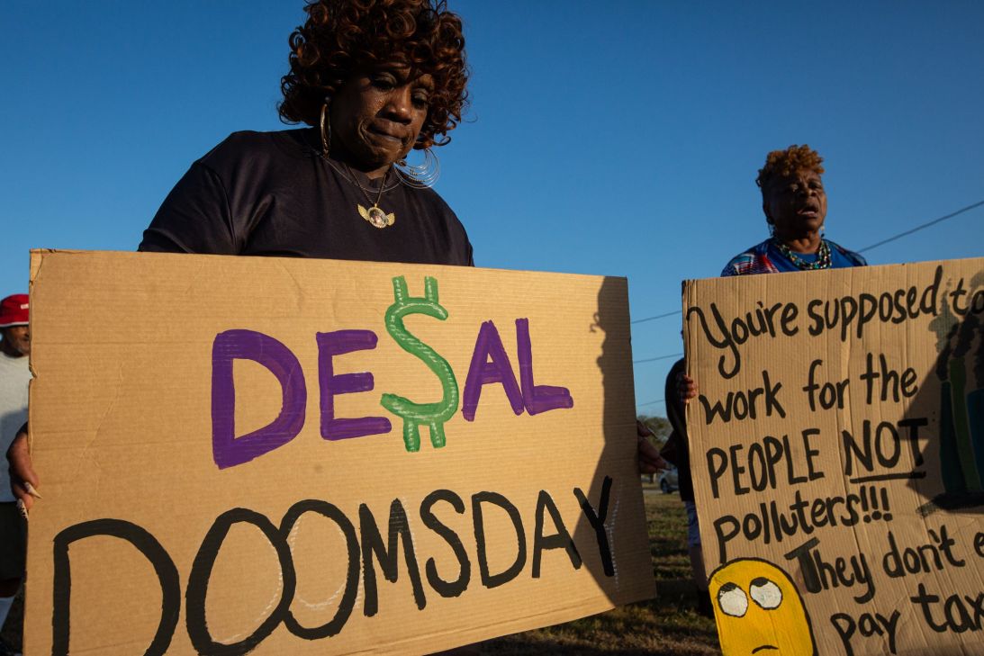From left, Debra Ramirez and Lois Malvo demonstrate against the proposed Inner Harbor desalination plant in Corpus Christi in 2024.