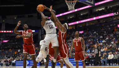 Mar 12, 2026; Nashville, TN, USA;  Texas A&M Aggies forward Rashaun Agee (12) shoots over Oklahoma Sooners forward Mohamed Wague (5) during the first half at Bridgestone Arena. Mandatory Credit: Steve Roberts-Imagn Images