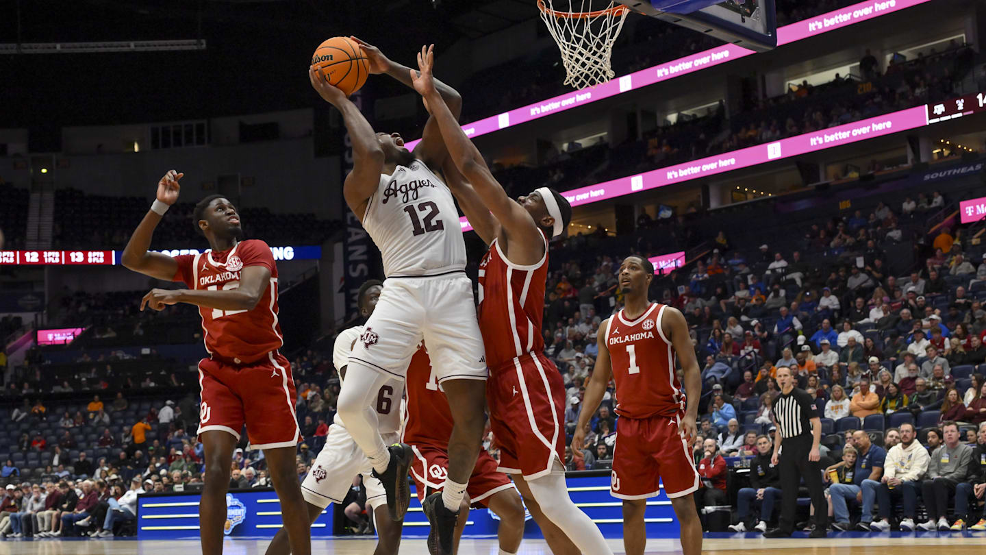 Mar 12, 2026; Nashville, TN, USA;  Texas A&M Aggies forward Rashaun Agee (12) shoots over Oklahoma Sooners forward Mohamed Wague (5) during the first half at Bridgestone Arena. Mandatory Credit: Steve Roberts-Imagn Images