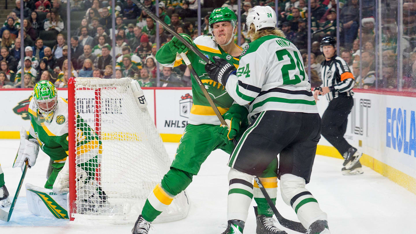 Dec 11, 2025; Saint Paul, Minnesota, USA; Minnesota Wild center Joel Eriksson Ek (14) and Dallas Stars center Roope Hintz (24) collide behind the net in the second period at Grand Casino Arena. Mandatory Credit: Matt Blewett-Imagn Images