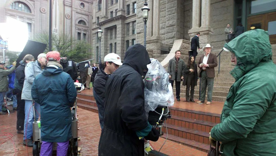 Film crew and cast members of the television series Walker Texas Ranger film a scene from the front of the historic Tarrant County Courthouse in downtown Fort Worth. Members of the cast Judson Mills, who plays Ranger Francis Gage, (l-r) Nia Peeples as Ranger Sydney and Michael Costello, as Texas Ranger Jensen. Filming was done Tuesday, March 27, 2001.