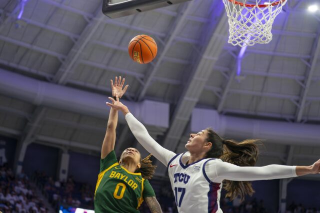 Redshirt Sophomore guard Taliah Scott lays up a shot over TCU’s Sophomore center Clara Silva during the Bears' 65-53 loss on Sunday evening against TCU at Schollmaier Arena in Fort Worth. Jake Schroeder | Photographer