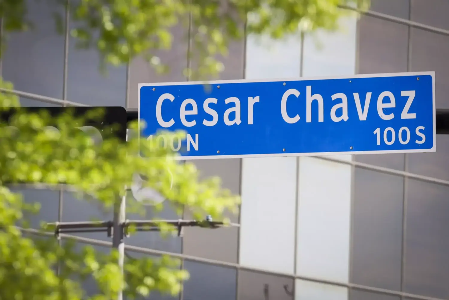 A sign for Cesar Chavez Boulevard in downtown Dallas.