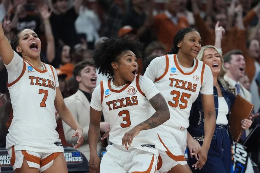 Texas guard Jordan Lee (7), guard Rori Harmon (3), forward Madison Booker (35) celebrate their win over Oregon in the second round of the NCAA college basketball tournament, Sunday, March 22, 2026, in Austin, Texas. (AP Photo/Eric Gay)