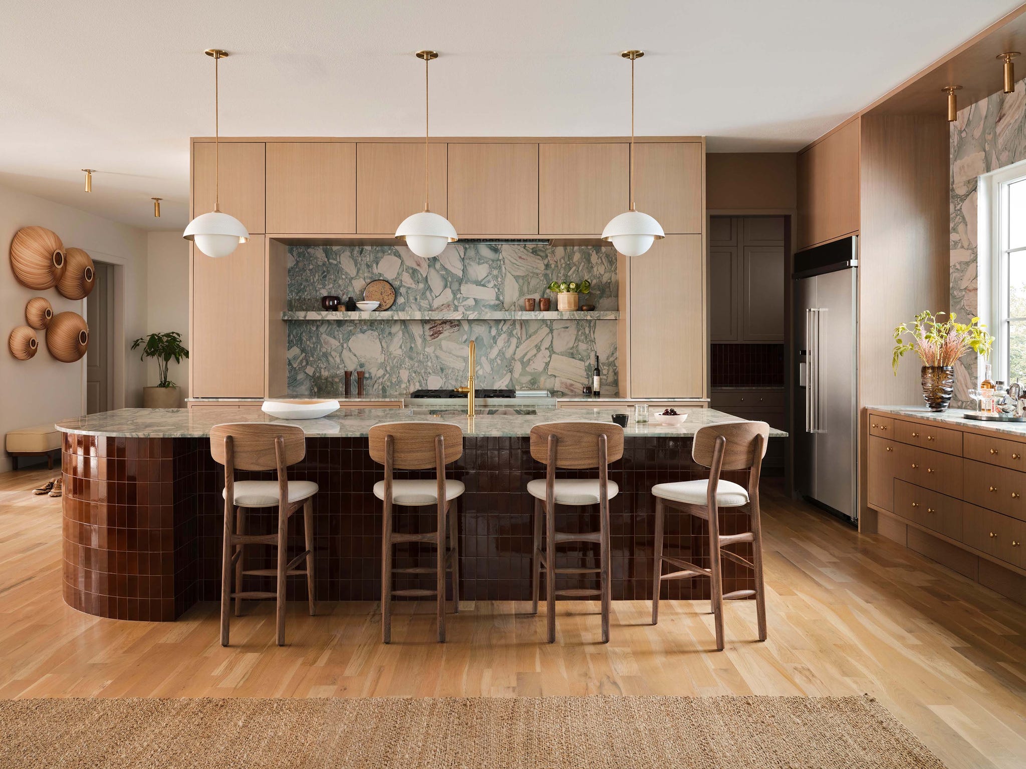 Modern kitchen with an island and stylish decor elements.
