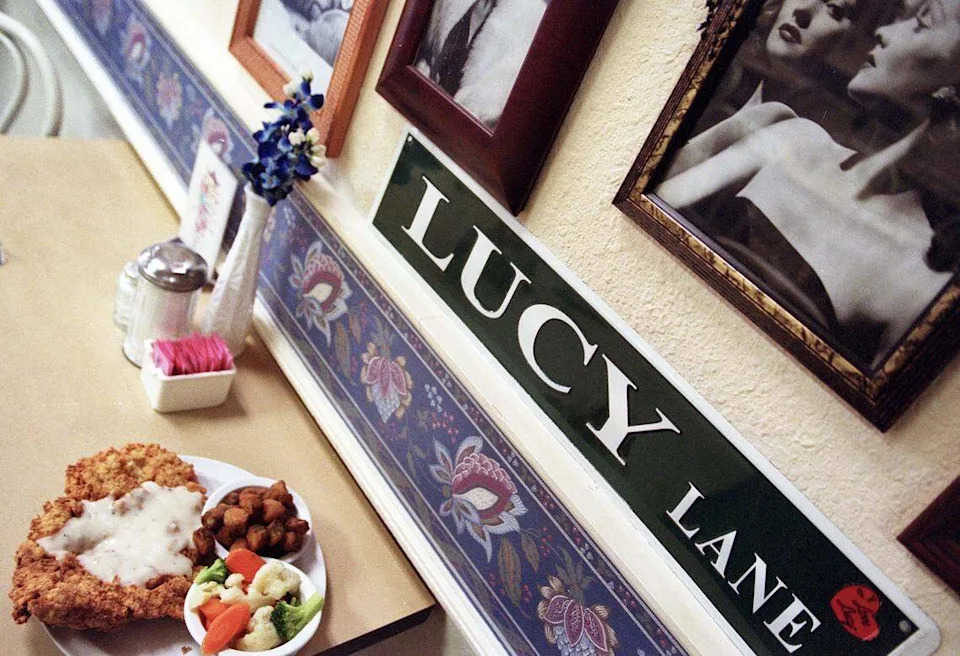 Chicken-fried chicken with a side of fried okra and carrots, broccoli and cauliflower among the “I Love Lucy” memorabilia at Bluebonnet Cafe in Haltom City, Texas, unchanged since this scene January 16, 2004.