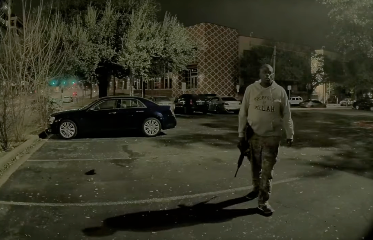 Video from a parked car recorded the shooter holding his rifle, then raising it and firing at someone passing by.