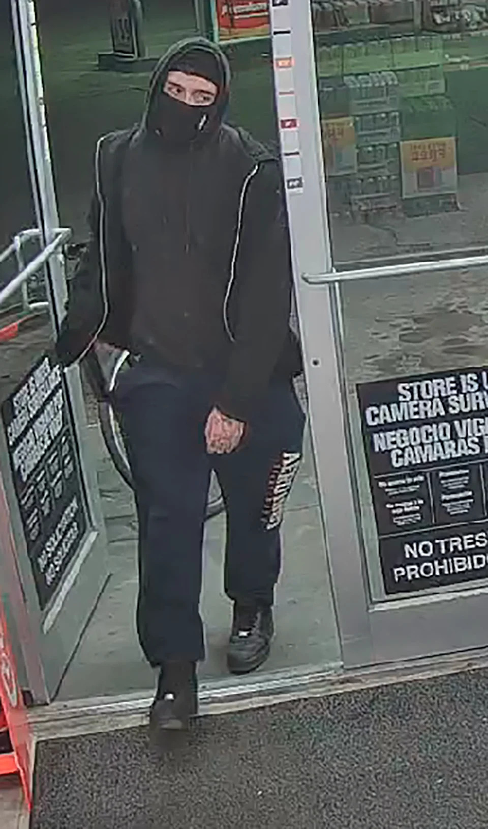 A security camera image shows an unidentified masked man entering during an armed robbery of the Circle K on Rushing Road next to Veterans Park in Northeast El Paso on Feb. 8, 2026.
