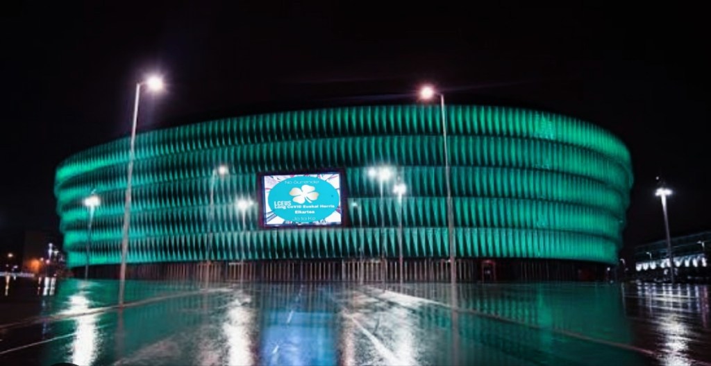San Mamés Stadium in Bilbao, Spain lit up teal against the night sky for Long COVID Awareness Day.