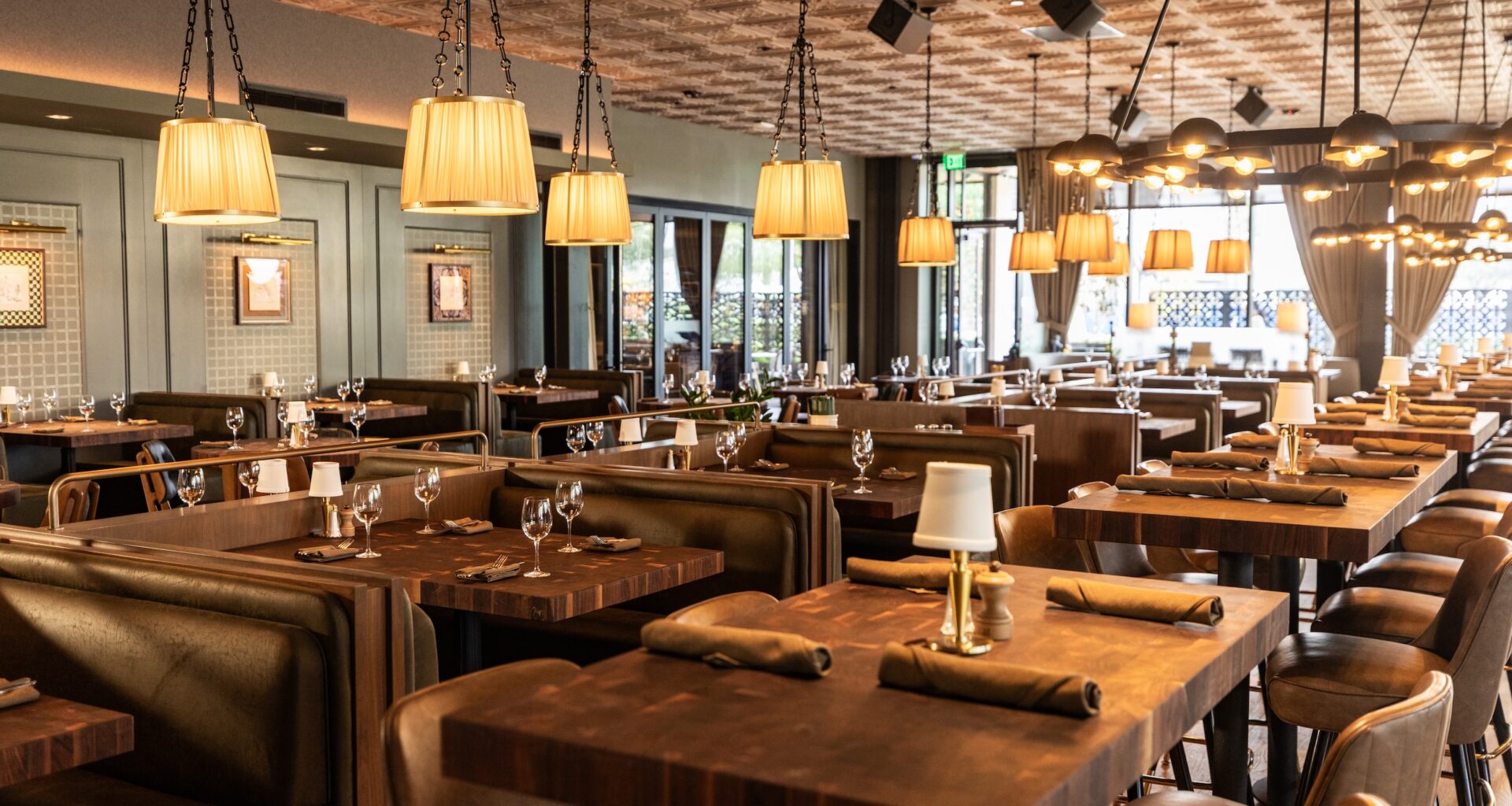 The interior of The Henry; lots of nice tables and warm lighting.