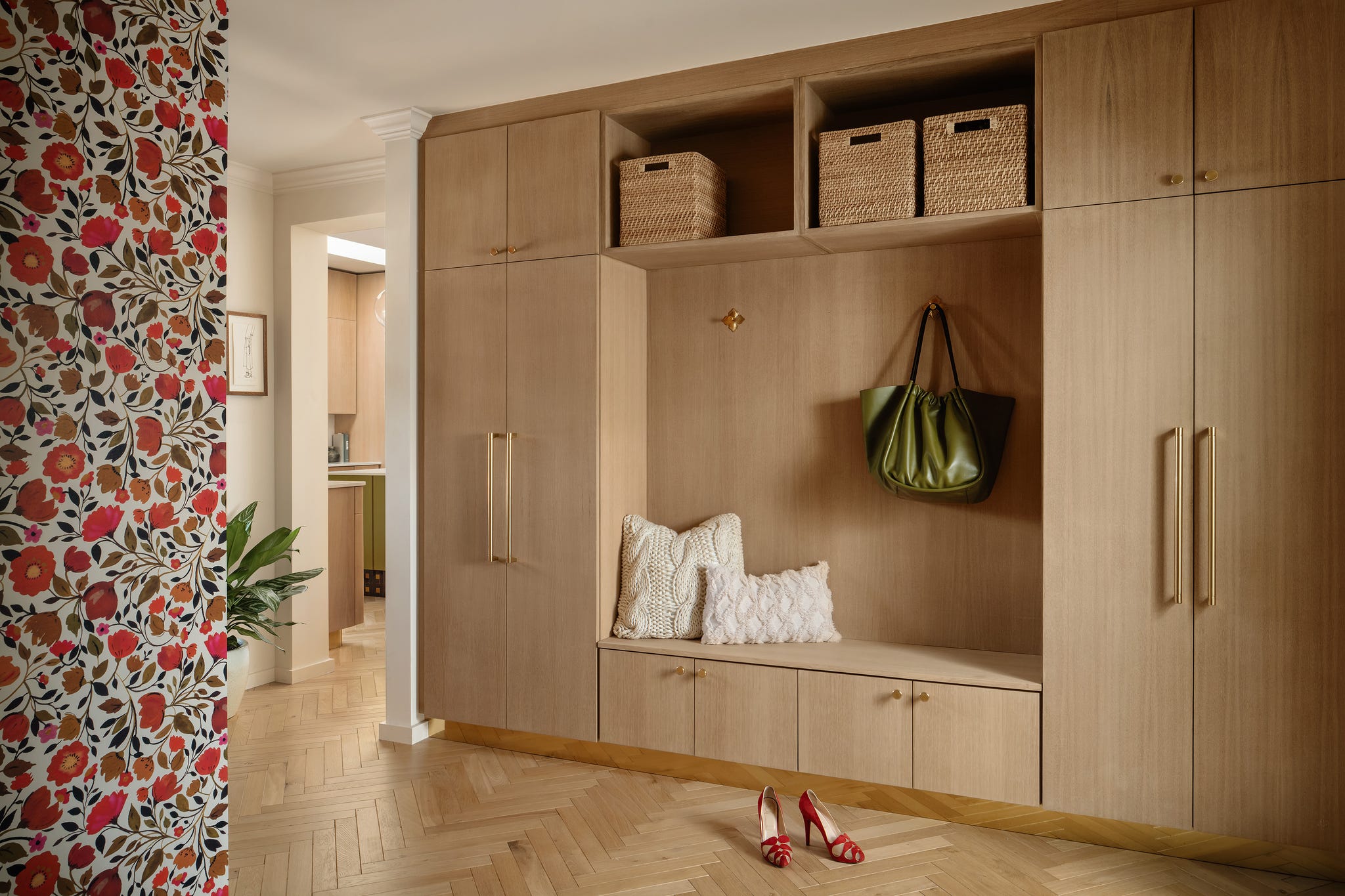 Stylish entryway with wooden storage and decorative elements.