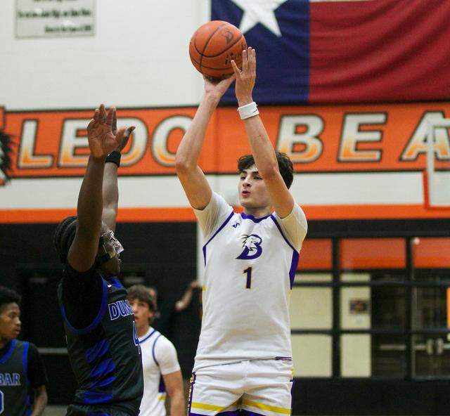 Brock’s Eli Paez (1) shoots over Fort Worth Dunbar’s Dreyon Crear (4) in a Class 4A Division II area-round playoff game on Thursday, February 26, 2026 at Aledo High School in Aledo, Texas.