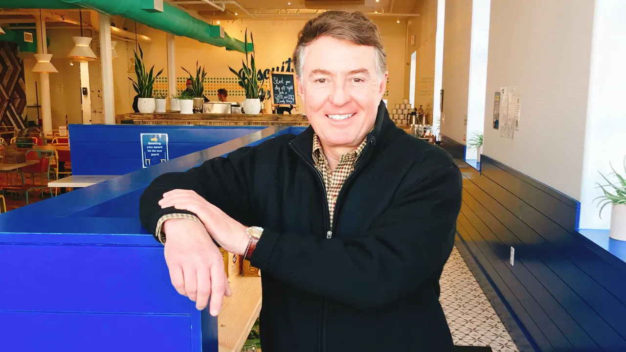 Photo of Chuck Schnatter inside Biscuit Belly location