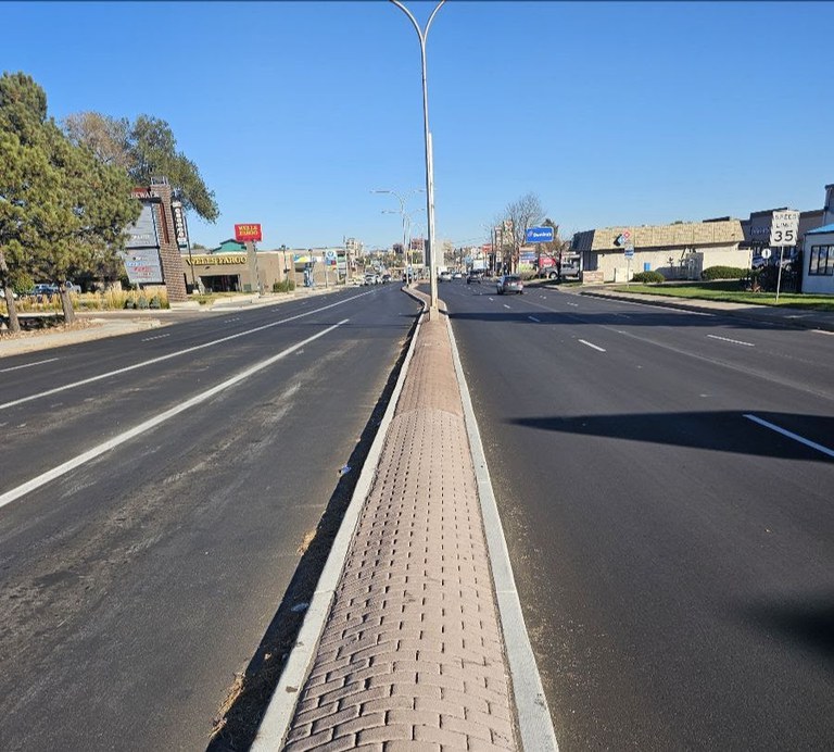 Newly resurfaced roadway with a median dividing the directions of traffic