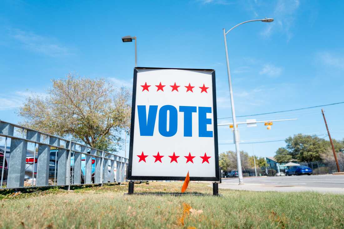 A "VOTE" sign is posted near a polling center in Austin, Texas on Tuesday. Texas is holding primary elections, including two hotly contested races for Democratic and Republican Senate nominations.