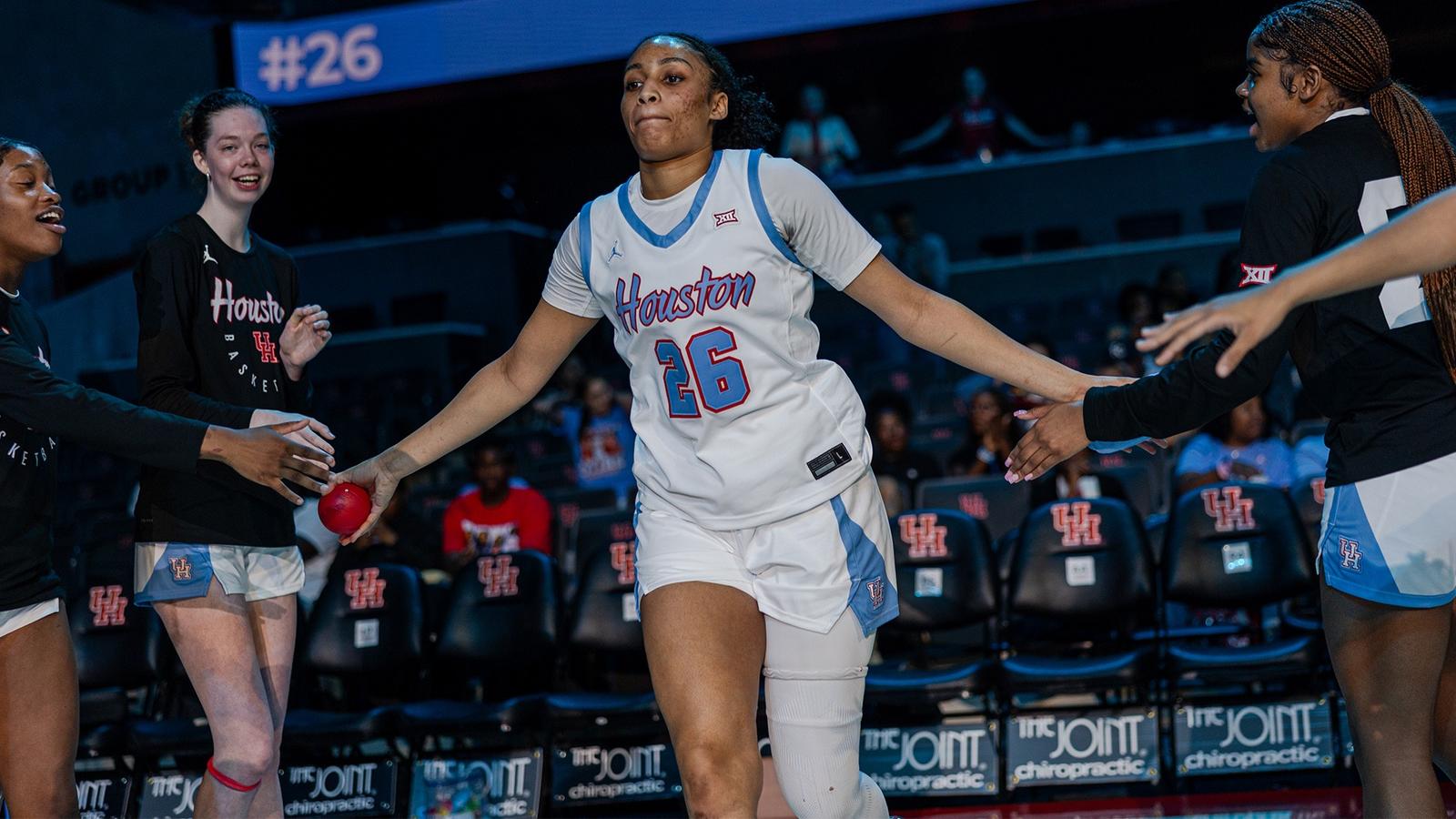 TK Pitts dribbling basketball vs. UCF defender