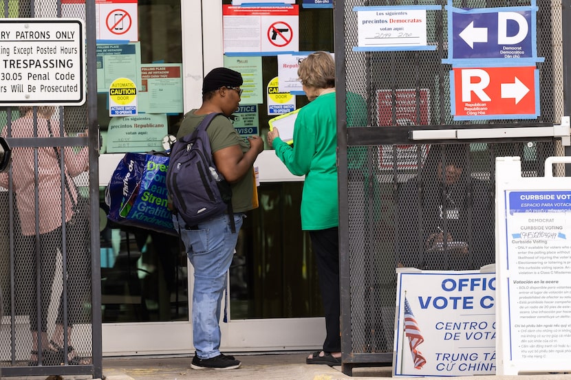 First time voter Brandy McIver (center left) is directed to a different polling location as...