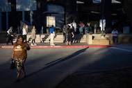 Cynthia Dunn, 54, leaves the Irving City Hall polling center after being sent to another...