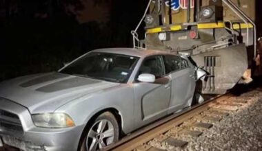 Train crashes into vehicle after driver loses control and lands on tracks