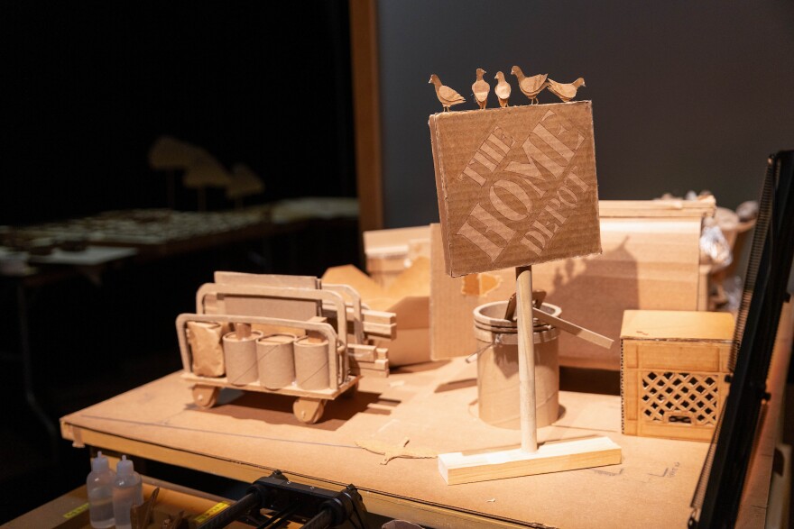 The Home Depot sign prominently featured in the performance of Robin Frohardt’s “Shopping Center for the Universe” in the McCullough Theatre in Austin, Texas, on Mar. 1, 2026. Joe Ferrara/KUT News