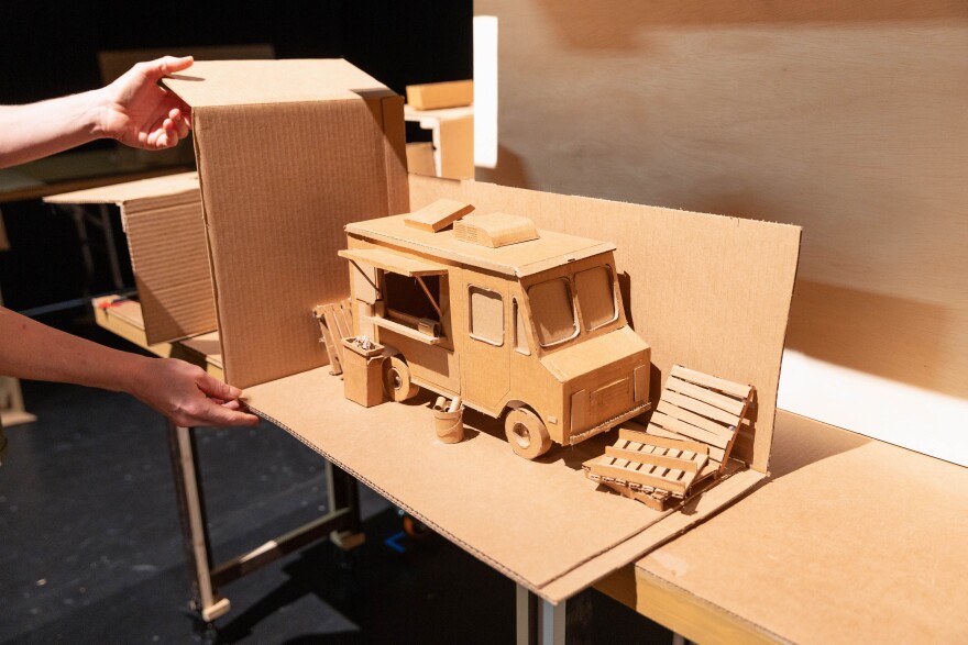 Cardboard is added to a food truck creation.