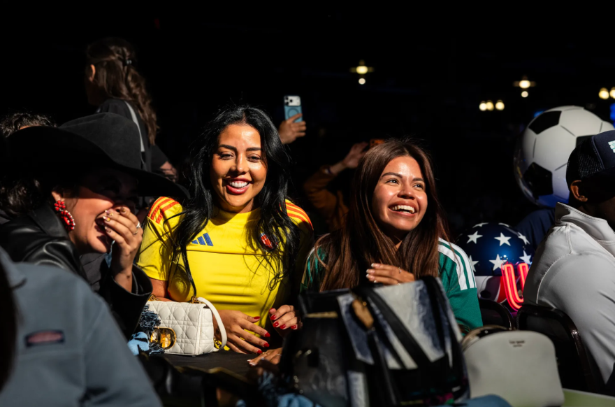 Dora Caro, left, and Silvana Jim cheer as Colombia is drawn for Group K position 4 at the Official FIFA World Cup 2026 Draw Party Experience at Billy Bob’s in Fort Worth on Dec. 5, 2025. ()