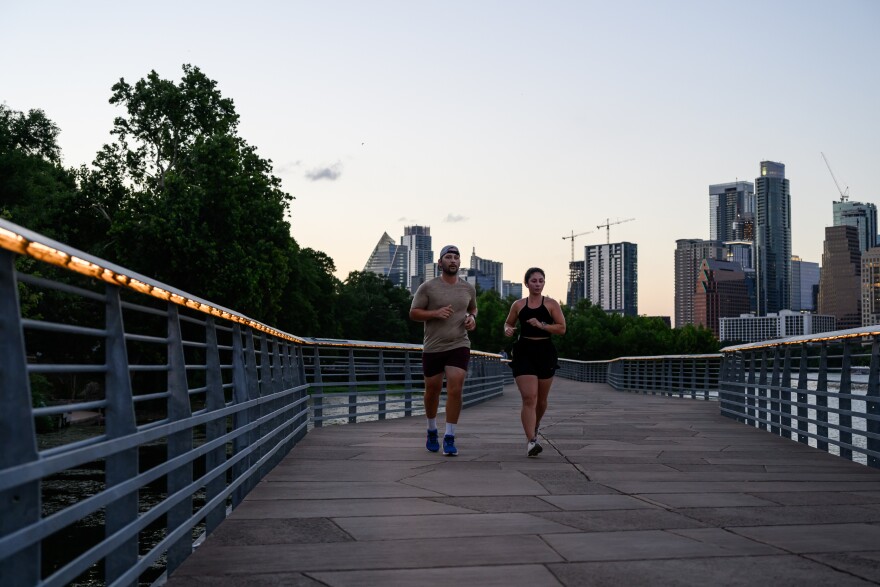 David Hope and Adria Saldivar run along the boardwalk that opened in 2014. The $28 million project was mostly funded with city property taxes and constructed as a public-private partnership with the Trail Conservancy.