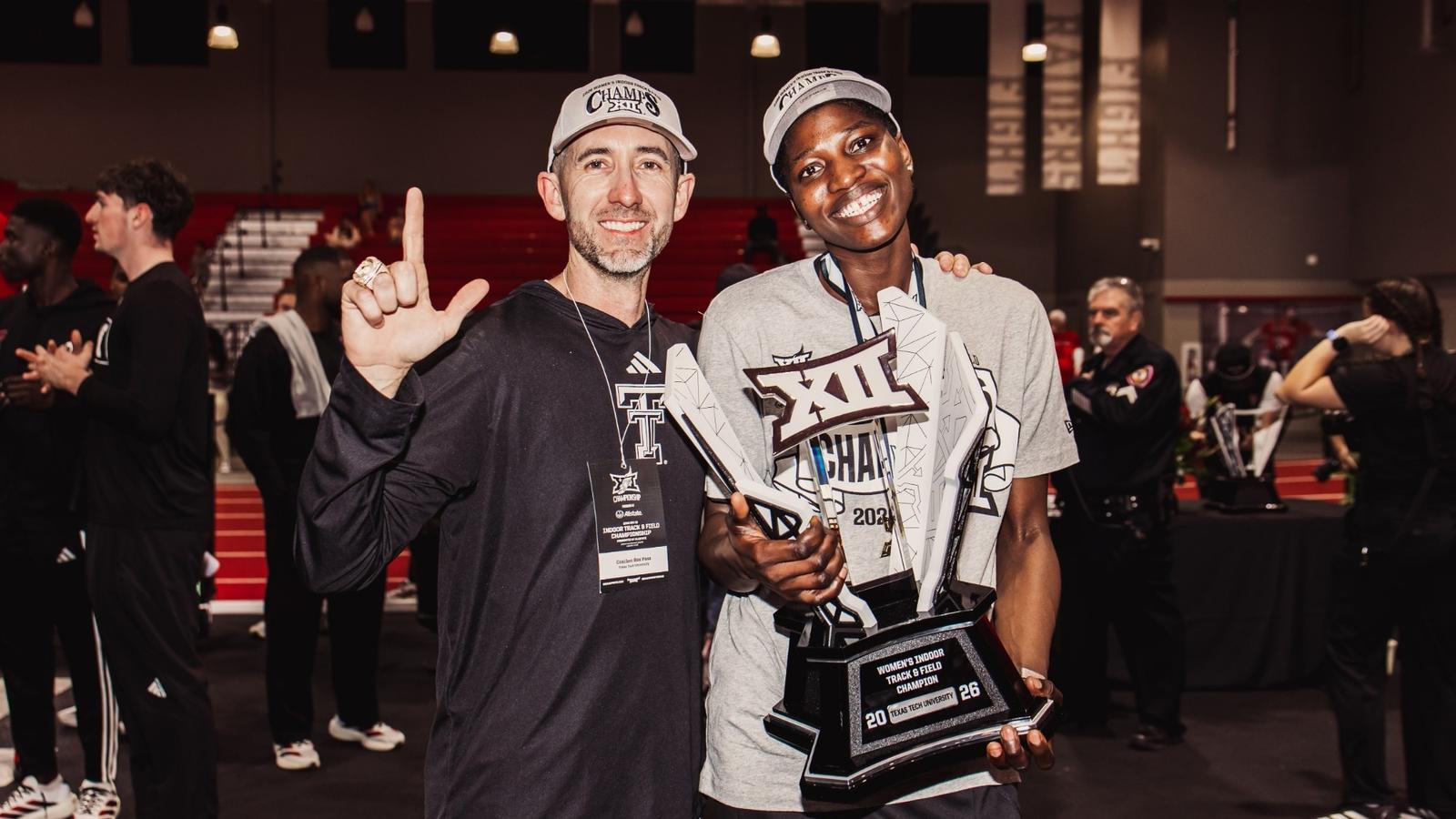 Wes Kittley holding the Big 12 Indoor trophy