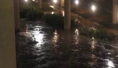 Cars try to drive through water after Houston rain
