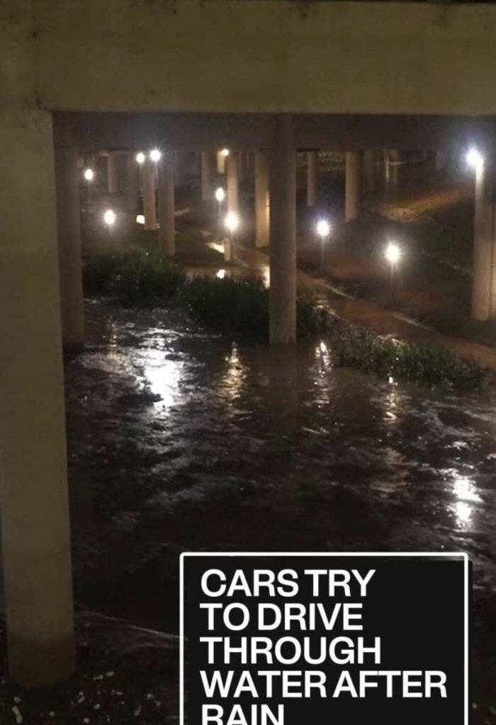 Cars try to drive through water after Houston rain