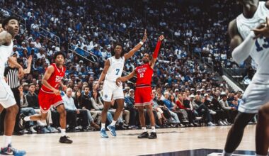 Christian Anderson drives past a BYU defender for a basket.