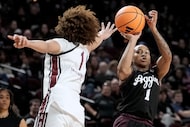 Texas A&M guard Ny'ceara Pryor, right, prepares to shoot a a 3-point basket over South...