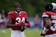 Arizona Cardinals safety Jalen Thompson (34) talks with his teammates during a joint NFL...