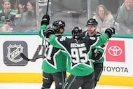 Dallas Stars defenseman Miro Heiskanen (4) celebrates with center Matt Duchene (95) and left...