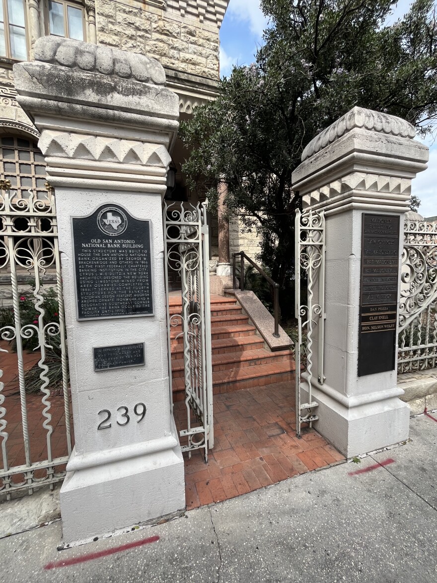 A plaque describing the construction of the Loan & Trust building and its registration with the National Register of Historic Places