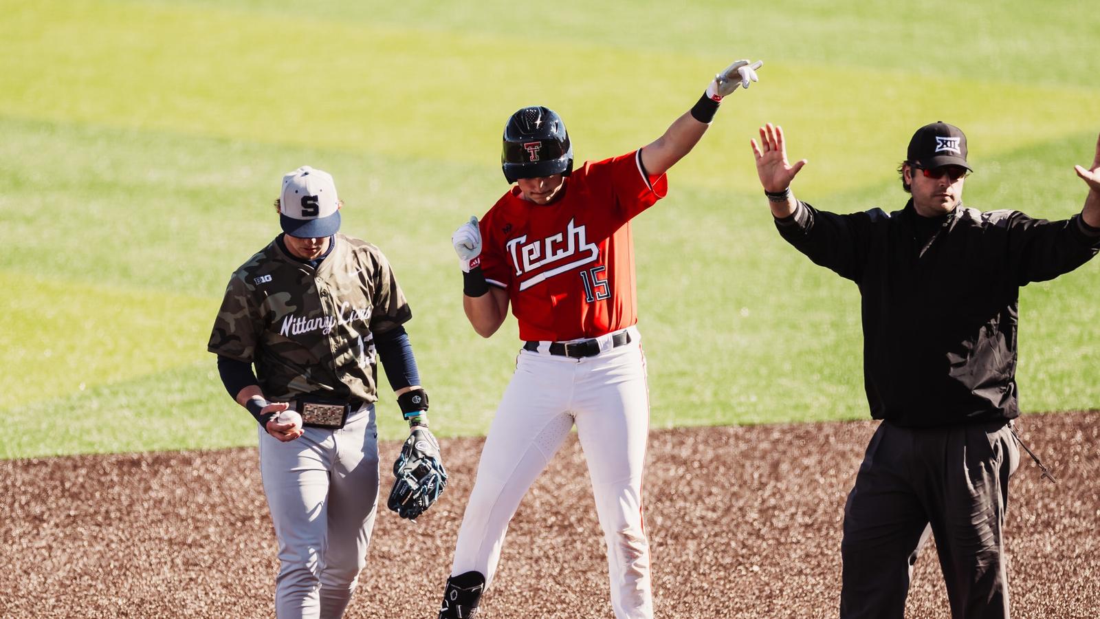 Catcher Matt Quintanar and INF Tracer Lopez pose following the Red Raiders win over Penn State on Saturday, Mar. 7